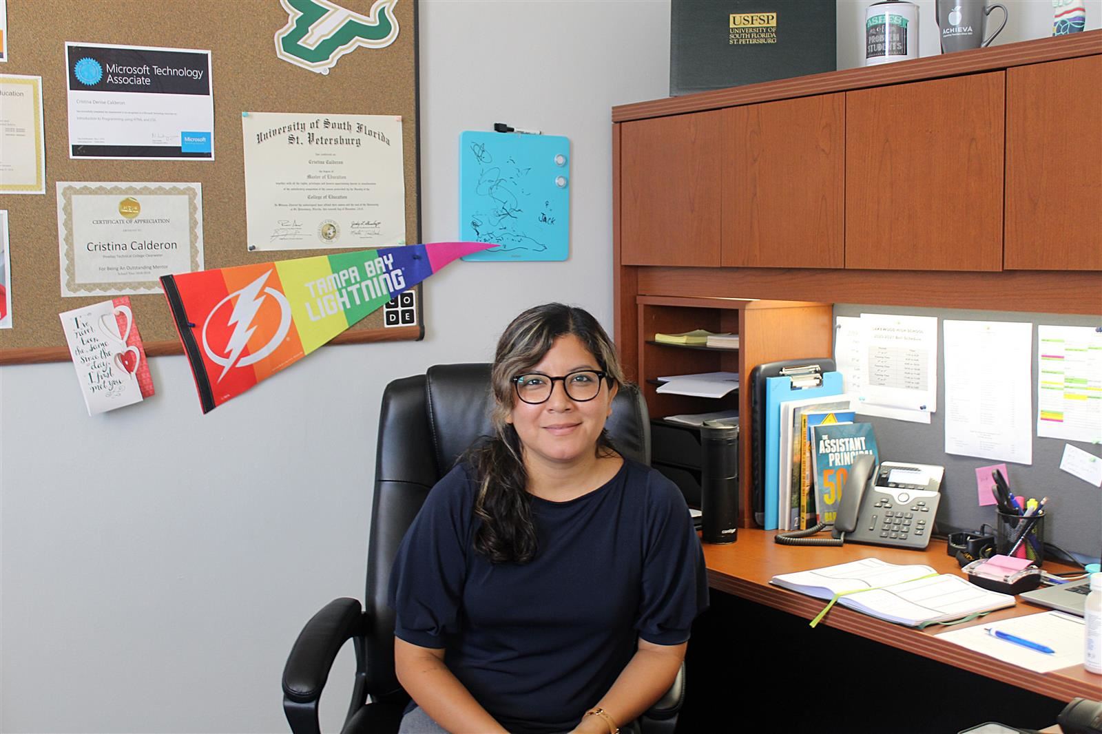 Assistant principal Cristina Calderon sits at her desk. 